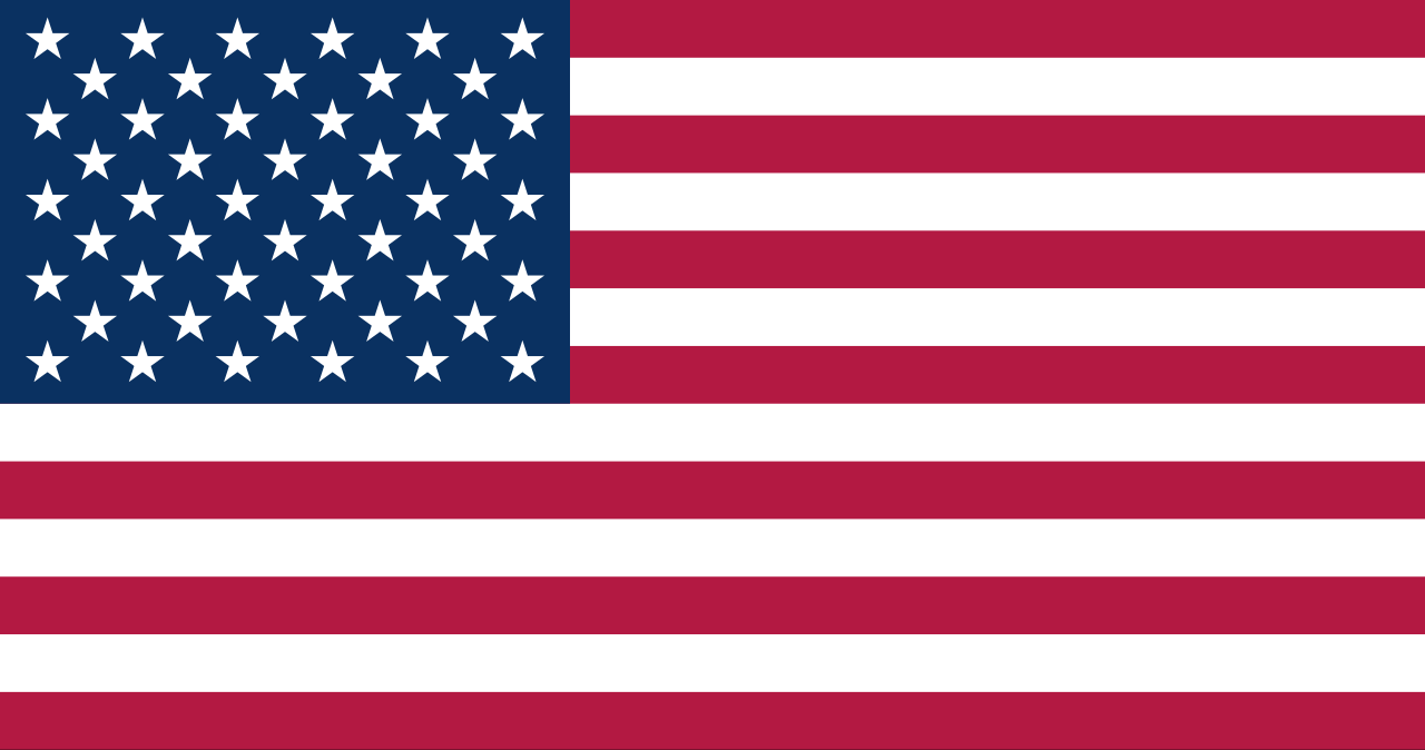 アメリカ合衆国の国旗（星条旗）。13本の縞と50の星が描かれた、自由と統合を象徴する歴史的シンボル。